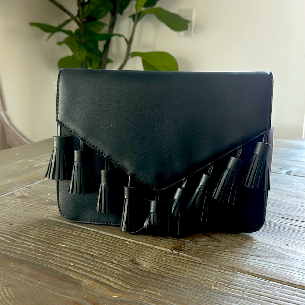 Black tassel, trimmed purse